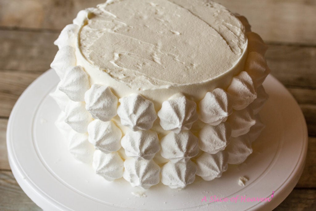 Meringues on the side of the cake