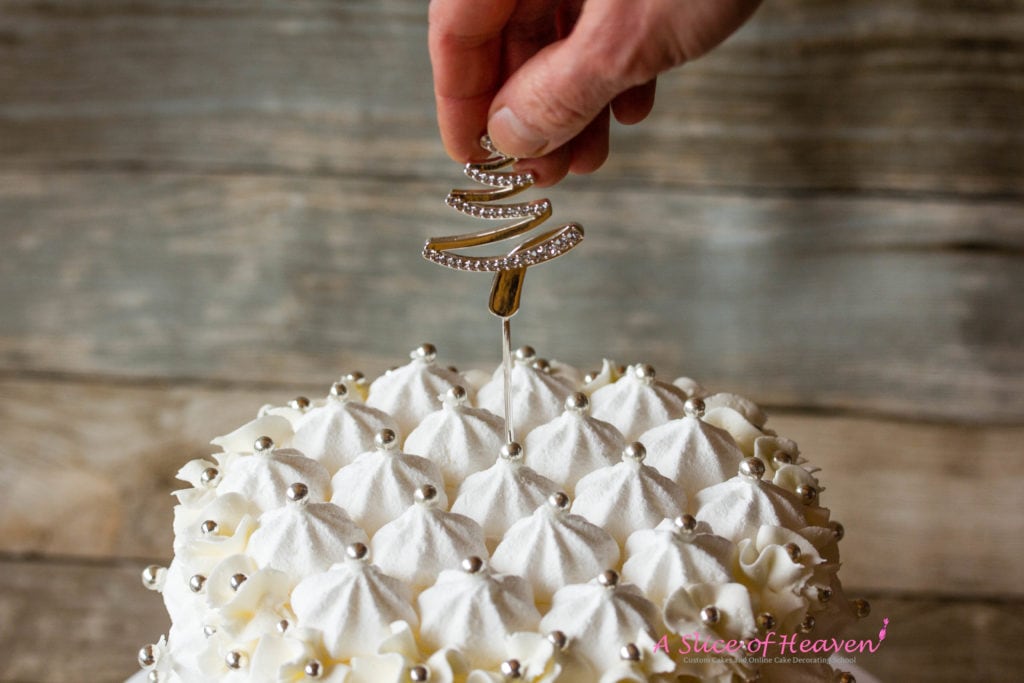 Inserting a cake topper