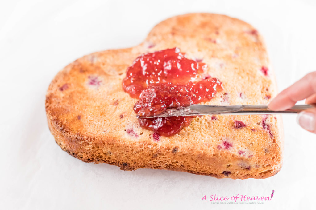 Spreading raspberry preserves