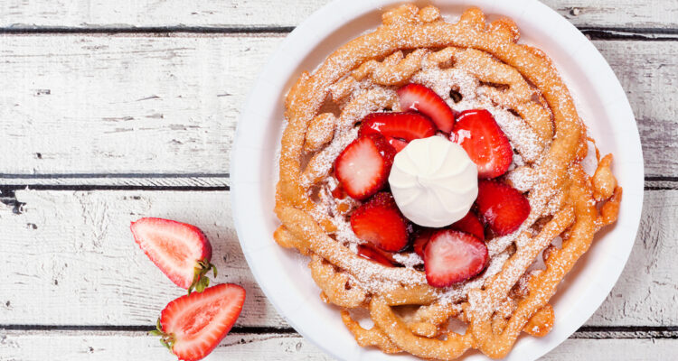 Funnel cake with strawberries and cream